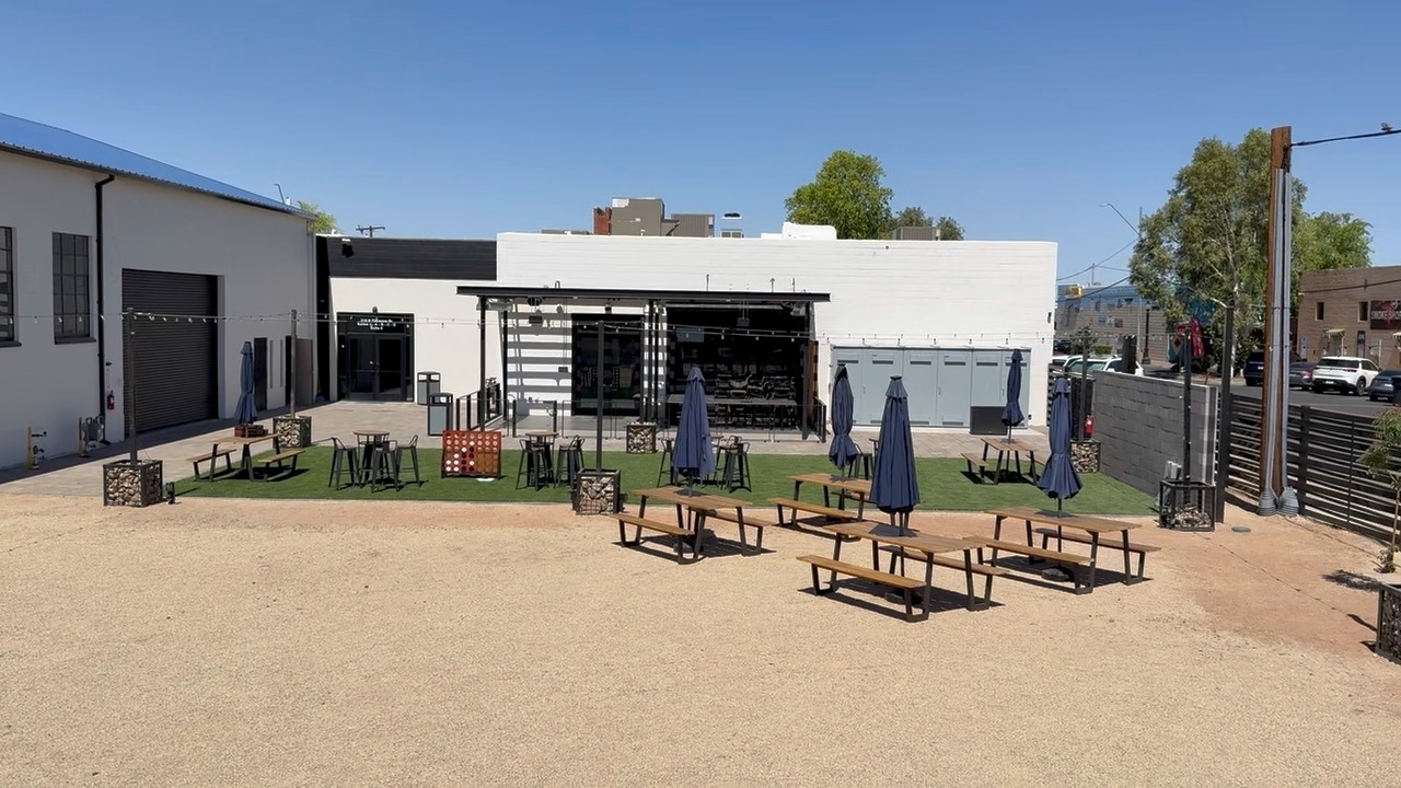 Terminal 318 courtyard view with picnic seating and main building facade